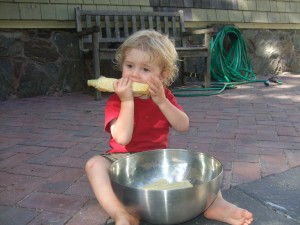 Ian eating the cob after the corn was cut off, July 22, 2010